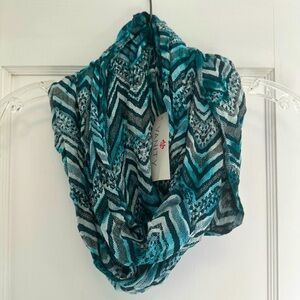 4/$20 DEAL ON ANY BUNDLE OF SCARVES
Vanity Chevron Knit Scarf - Teal and Black